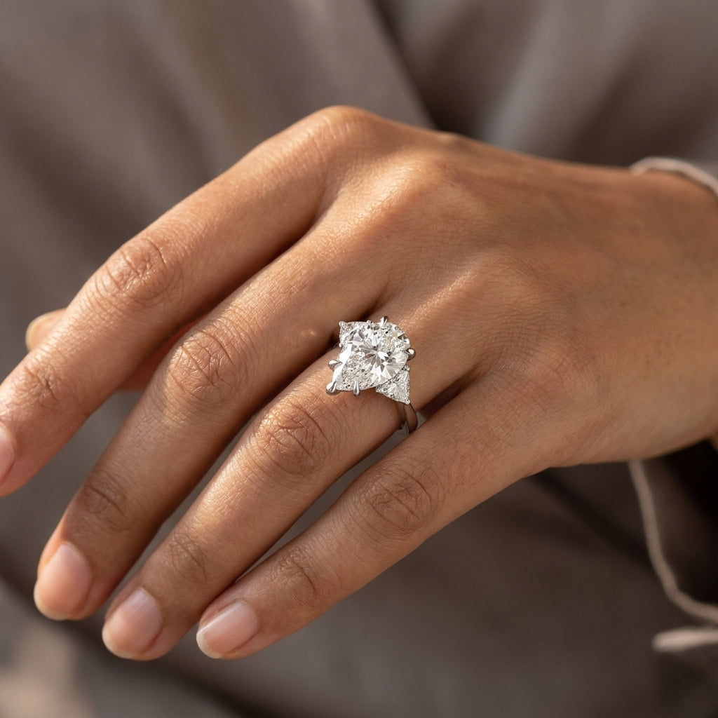 Meiara AI Lifestyle — Eve Pear Claw Prong Three-Stone Ring