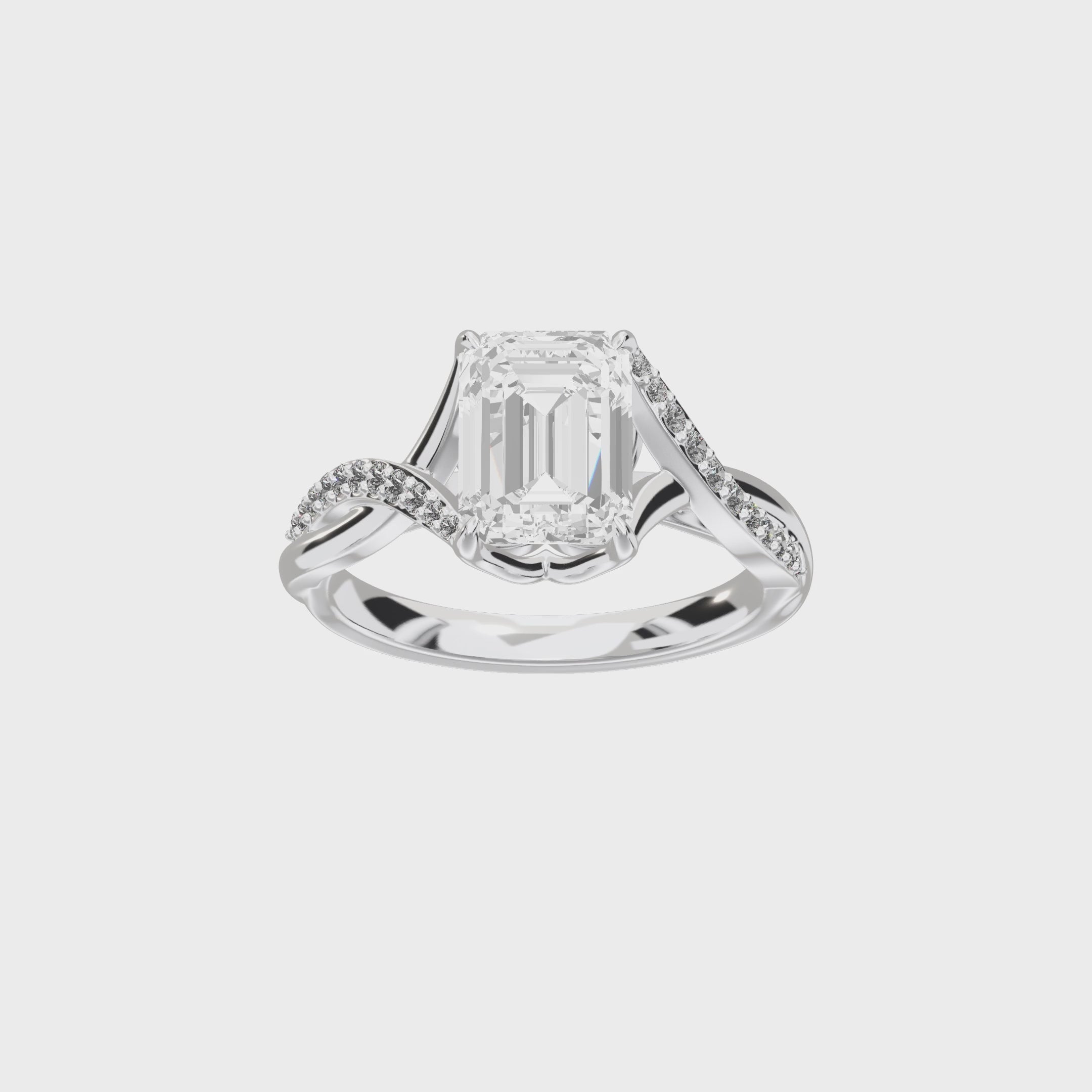 Eve Emerald Twisted Side-Stone Engagement Ring — 360 spin